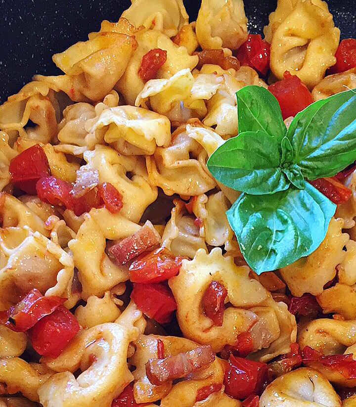 chicken-stuffed-tortellini-in-a-fresh-cherry-tomato-and-pancetta-sauce